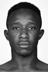 Face of young African man in black and white