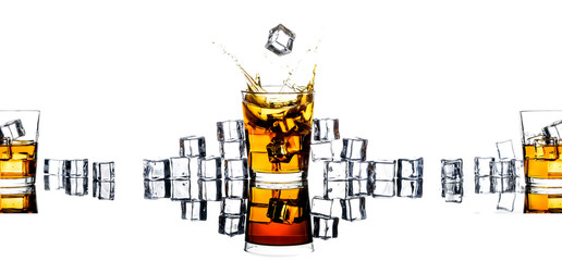 Whiskey with ice cubes.Isolated shot of whiskey.Glass of scotch and ice cubes on a white background.