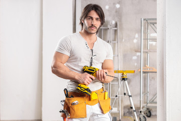 Muscular builder with a drill