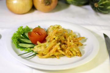vegetable tempura with tomato salad, cucumber and lettuce, selective focus