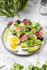 Cucumber, smoked tuna and avocado salad with egg