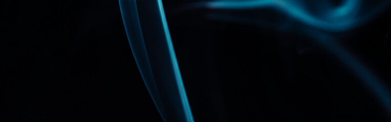 Blue smoke on black background