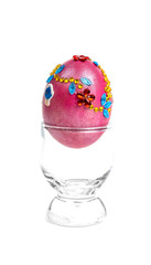 colorful eggs in glass on white