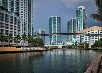 View of the Miami River and metrorail overpass with modern buildings