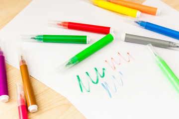 Felt-tip pens, pencils in boxes, different colors, the order on the table, the work of the child, home creation and order, the joy of drawing, school desk and quarantine