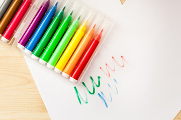 Felt-tip pens, pencils in boxes, different colors, the order on the table, the work of the child, home creation and order, the joy of drawing, school desk and quarantine