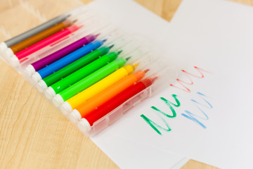 Felt-tip pens, pencils in boxes, different colors, the order on the table, the work of the child, home creation and order, the joy of drawing, school desk and quarantine