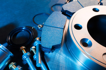 brake parts on dark background  brake pads, disc, brake hose, guides, cylinders - Image