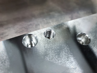 Close-up Threaded Hole and Counterbore Holes on Stainless Steel Plate - obrazy, fototapety, plakaty