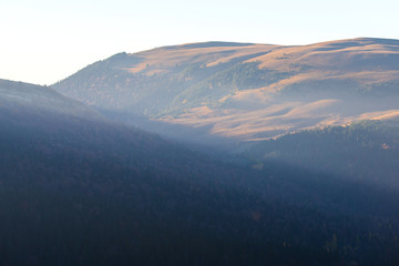 Evening in the mountains with the last rays of the sun
