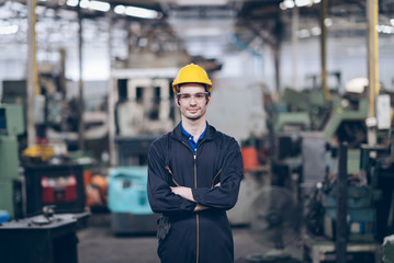 professional technician engineer standing  and arm cross in factory