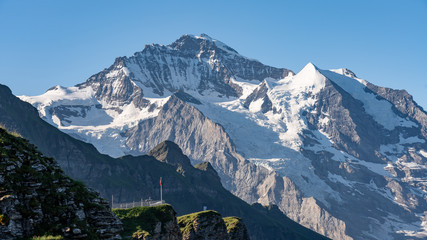 Switzerland, Panoramic view on Eiger, Monch and Jungfraujoch and green Alps around