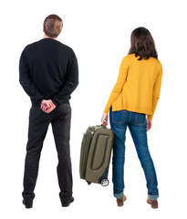 young couple in sweater traveling with suitcas.