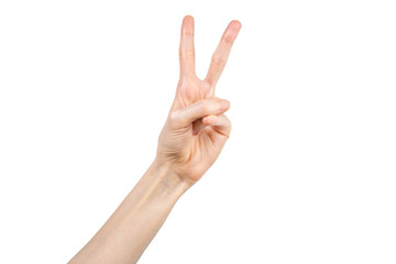 Hand of a Caucasian woman showing victory gesture on white background