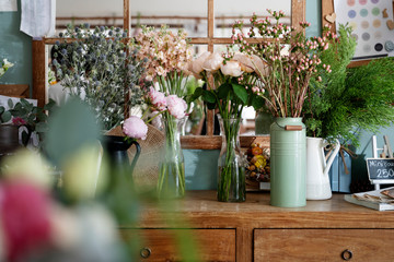 Vases of flowers on a sale counter