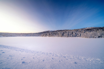  Icy road against snowcapped mountain