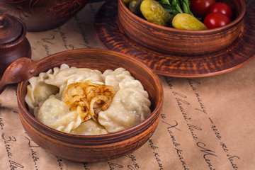 Russian Vareniky  - dumplings, pickles. Vareniky filled with potato and mushrooms, served with...