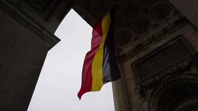 Belgium Flag under Arc De Triomphe In Parc Du Cinquantenaire, Brussels