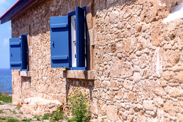 Stone house on the beach near the sea.