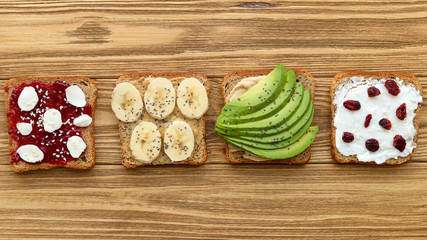 Assorted toast for breakfast, top view of healthy food