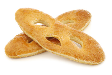 traditional sugar coated Dutch cookies called "krakeling" on a white background