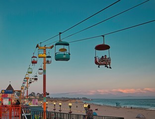 Beach boardwalk with an amusement park taken in Santa Cruz, CA