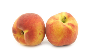 Fototapeta na wymiar two fresh peaches on a white background