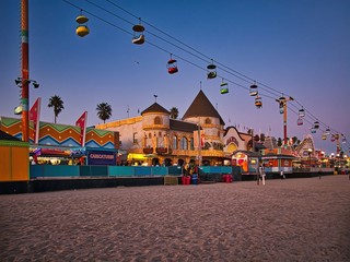 Beach boardwalk with an amusement park taken in Santa Cruz, CA