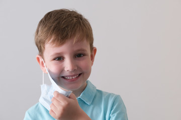 portrait of a boy in a medical mask