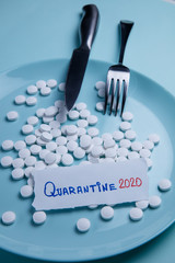 Fototapeta premium Quarantine pills on a plate
