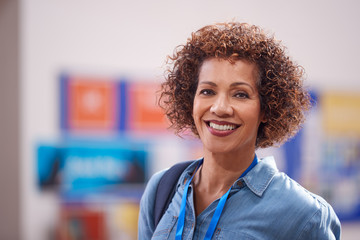 Portrait Of Mature Female Teacher Or Student In College Hall