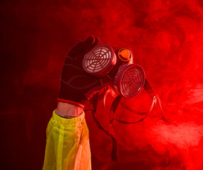 Firefighter passing a respirator during a fire