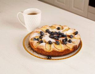 Breakfast time with coffee and big tasty pie on table
