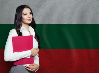Young woman with red book. Learn or business concept