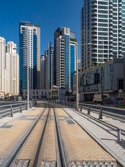 Fototapeta na wymiar February 2020: Promenade and canal in Dubai Marina with luxury skyscrapers around,United Arab Emirates