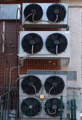 Air conditioning coolers on the facade of the building.