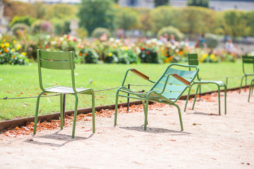Traditional green chairs in the Tuileries garden in Paris, France