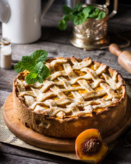 delicious homemade peach tart, made with fresh organic ingredients. Peach pie, fruit tart, apricot pie, fruit dessert. Vegetarian dessert. Vegan food concept, tea party. Galette