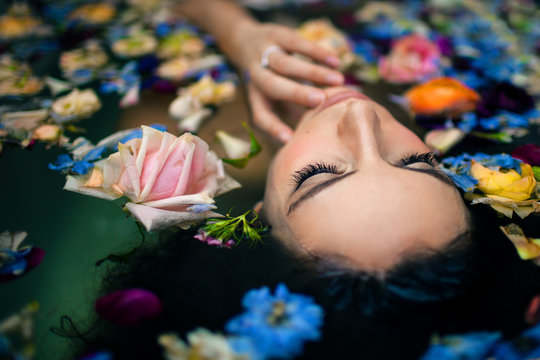 Close up of woman relaxing in bathtub