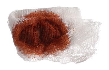 Medical bandage drenched in iodine isolated on white background with clipping path