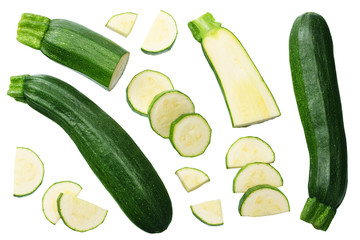fresh green zucchini with slices isolated on white background. top view