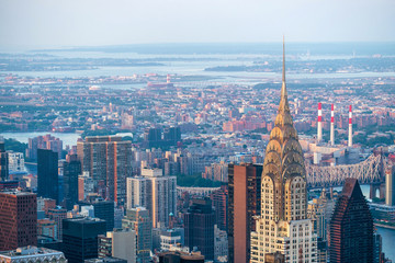 Manhattan skyline including architectural landmark Chrysler Building in New York City, United States of America. - obrazy, fototapety, plakaty