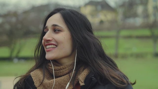 Young Indian Woman Yawning and Talking Outdoors