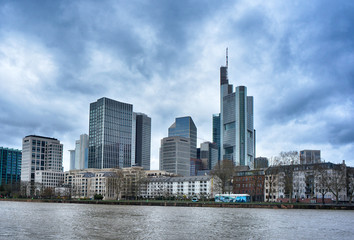 Fototapeta na wymiar Skyline of Frankfurt Main view over the Main river with dramatic clouds