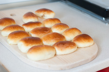 homemade patties pirozhki on wooden board 