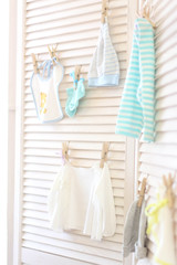 children's clothes hang on clothespins