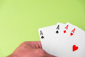 Four aces on green background. Concept of gambling risk. text space