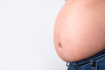 Close-up of a fat man's belly on a white background