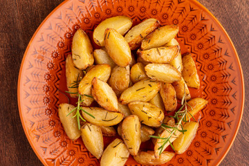 portion of roasted potatoes with olive oil and rosemary