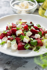 Baked beets with feta cheese and shoots of young peas